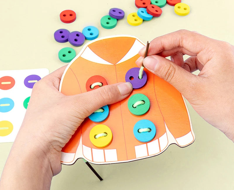 Clothes & button sewing board game.